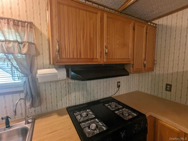 a view of a utility room with a sink