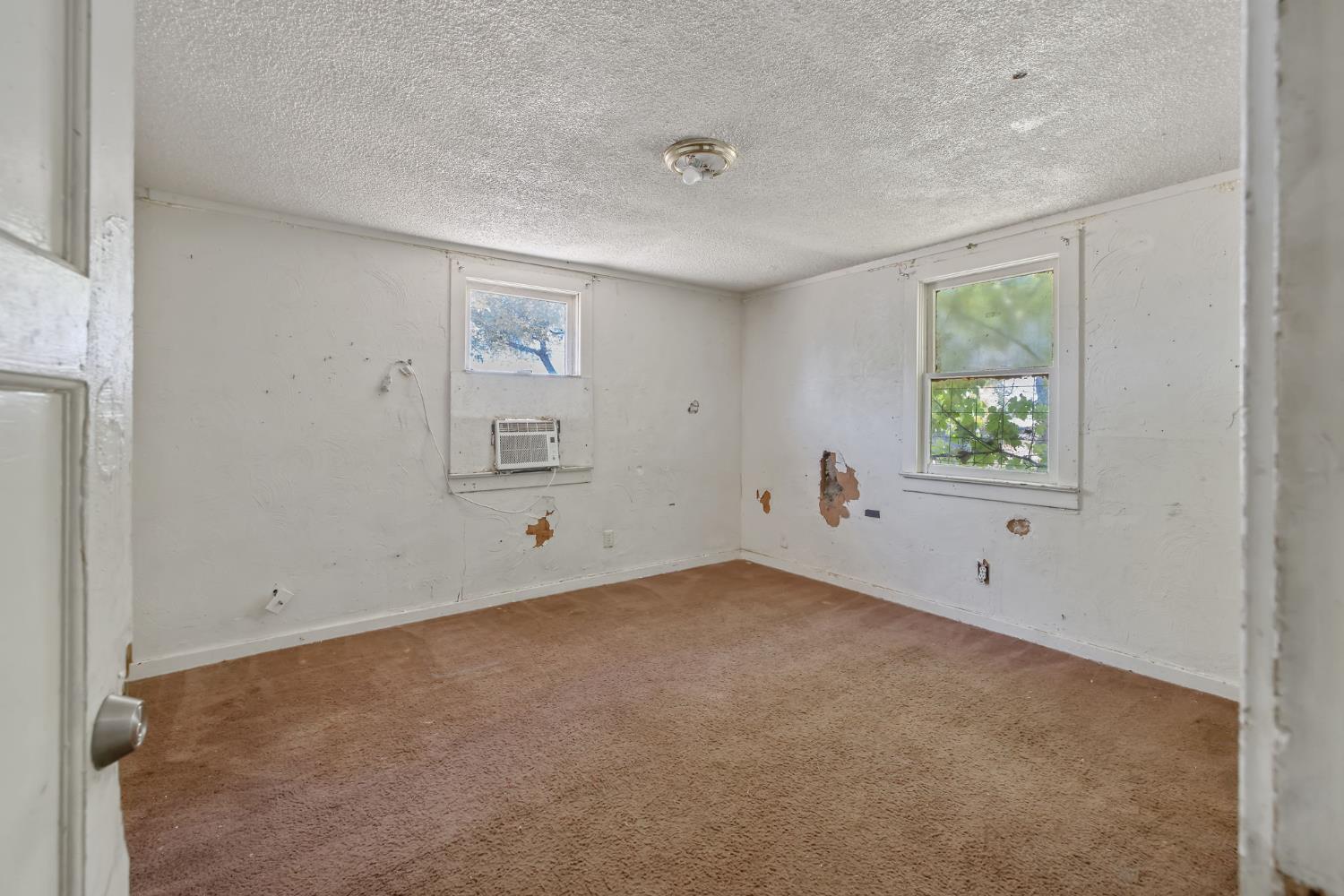 18309 Java Avenue Lemoore, CA 93245 - Photo 20 of 32 a view of an empty room with a window