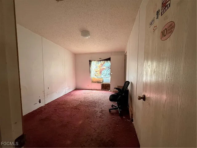 a bed room with a bed and a window