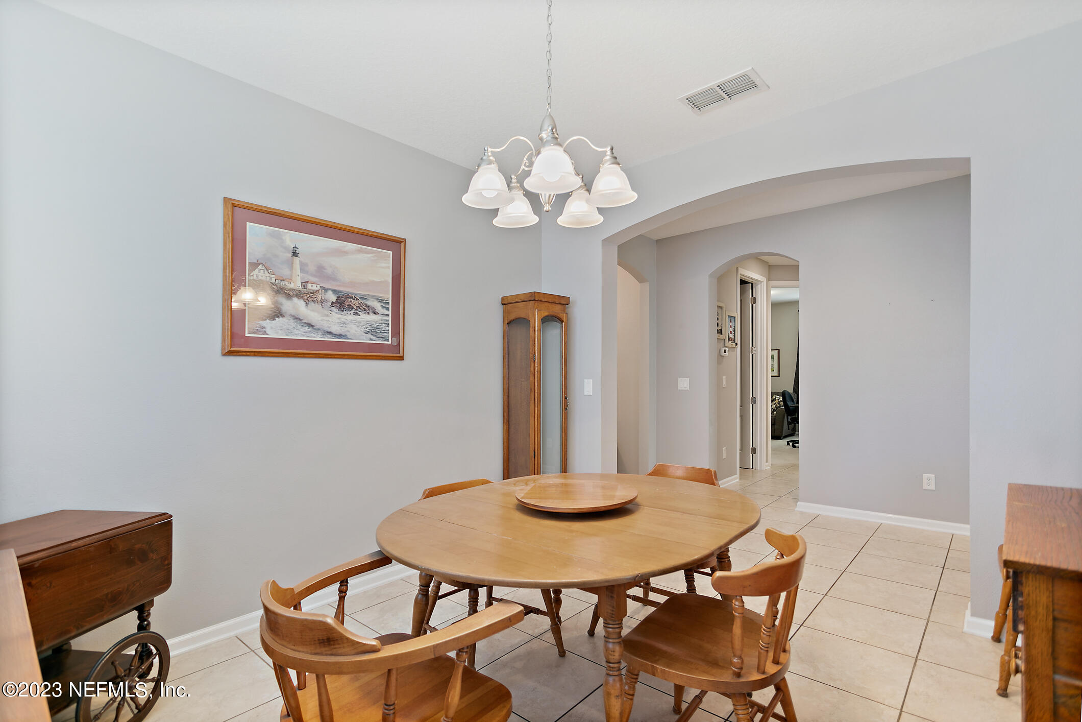 235 Pine Arbor Circle St. Augustine, FL 32084 - Photo 16 of 41 a view of a dining room with furniture and chandelier