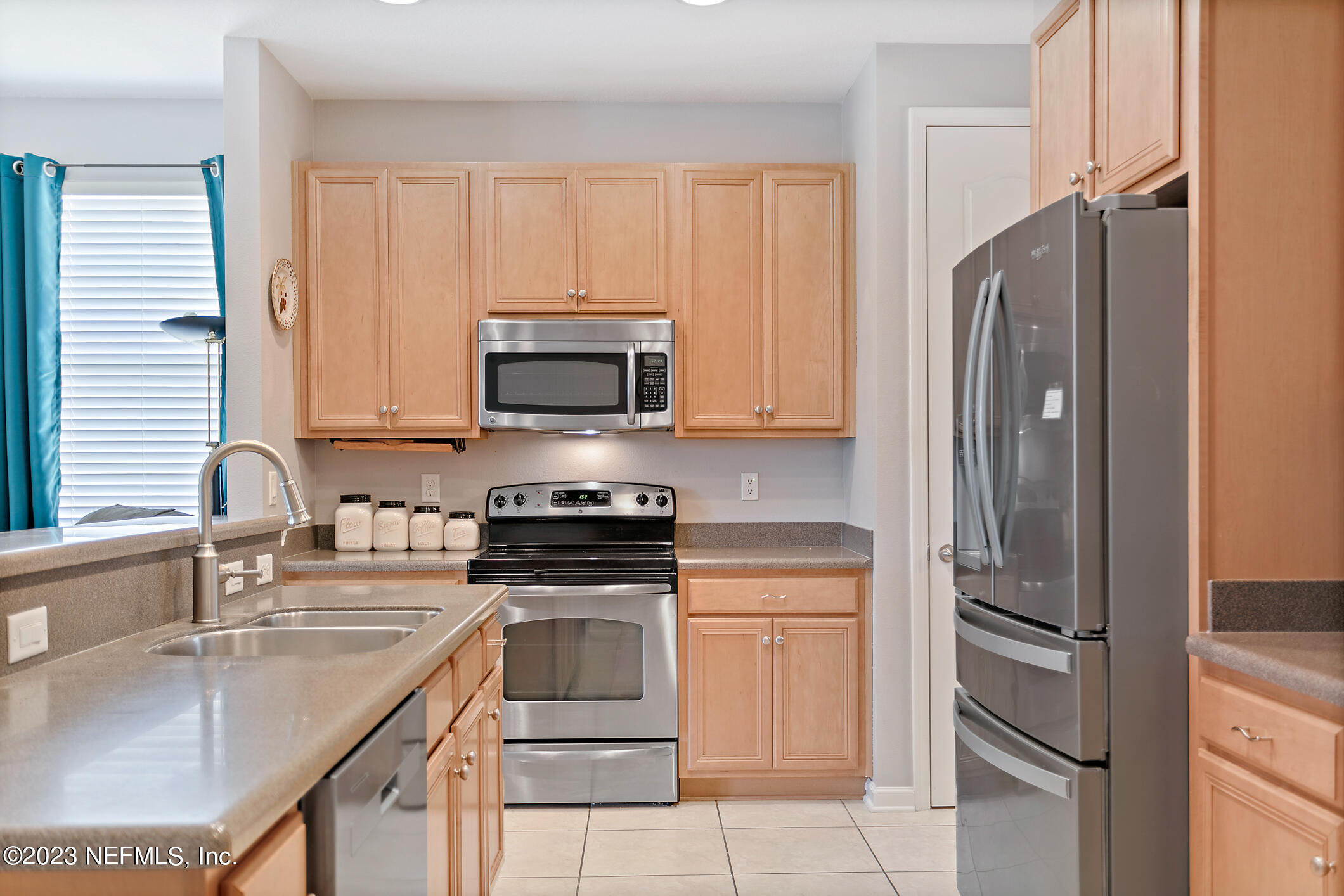 235 Pine Arbor Circle St. Augustine, FL 32084 - Photo 17 of 41 a kitchen with stainless steel appliances granite countertop a refrigerator stove and sink