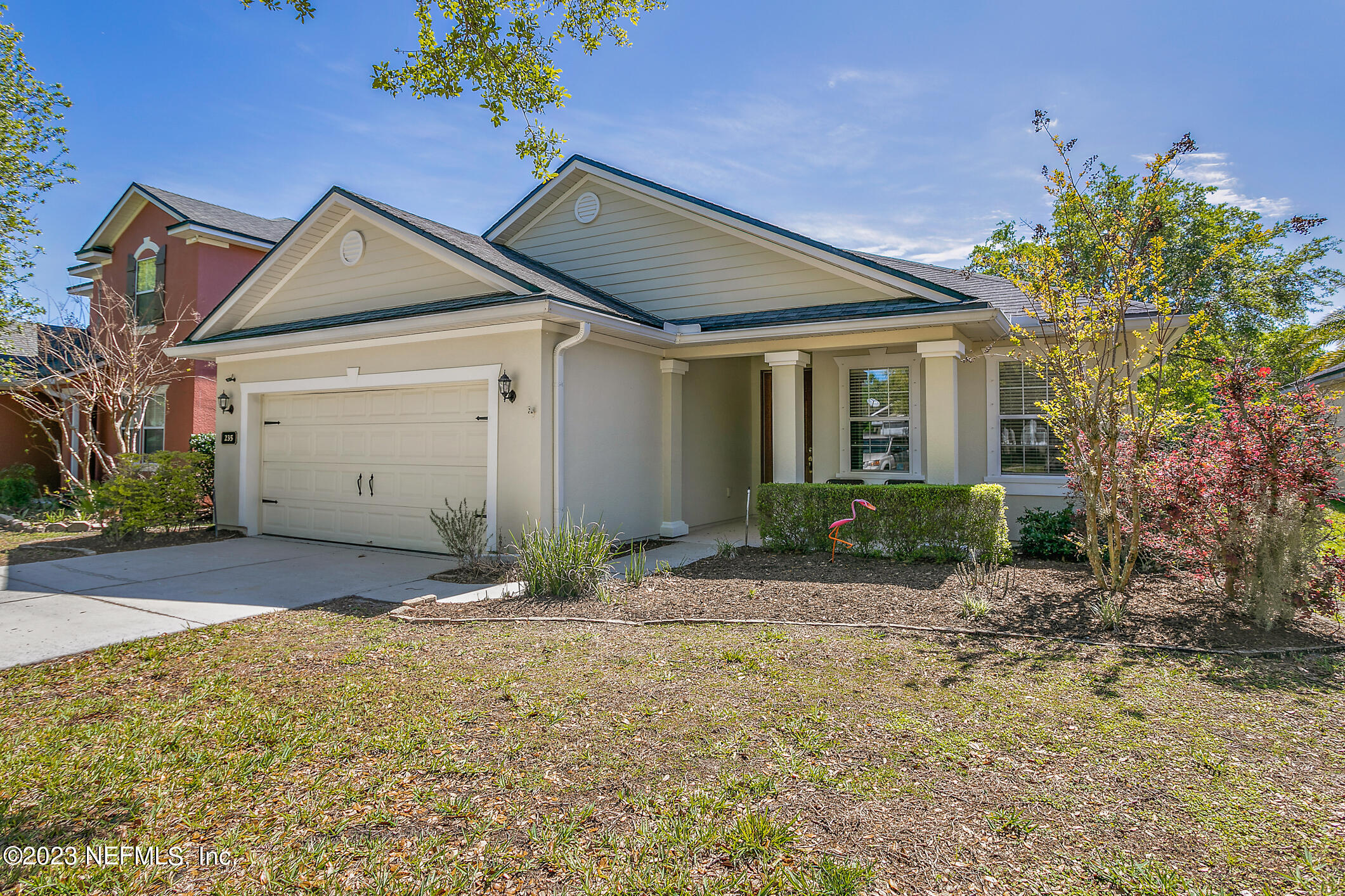235 Pine Arbor Circle St. Augustine, FL 32084 - Photo 2 of 41 a view of a house with a yard and potted plants