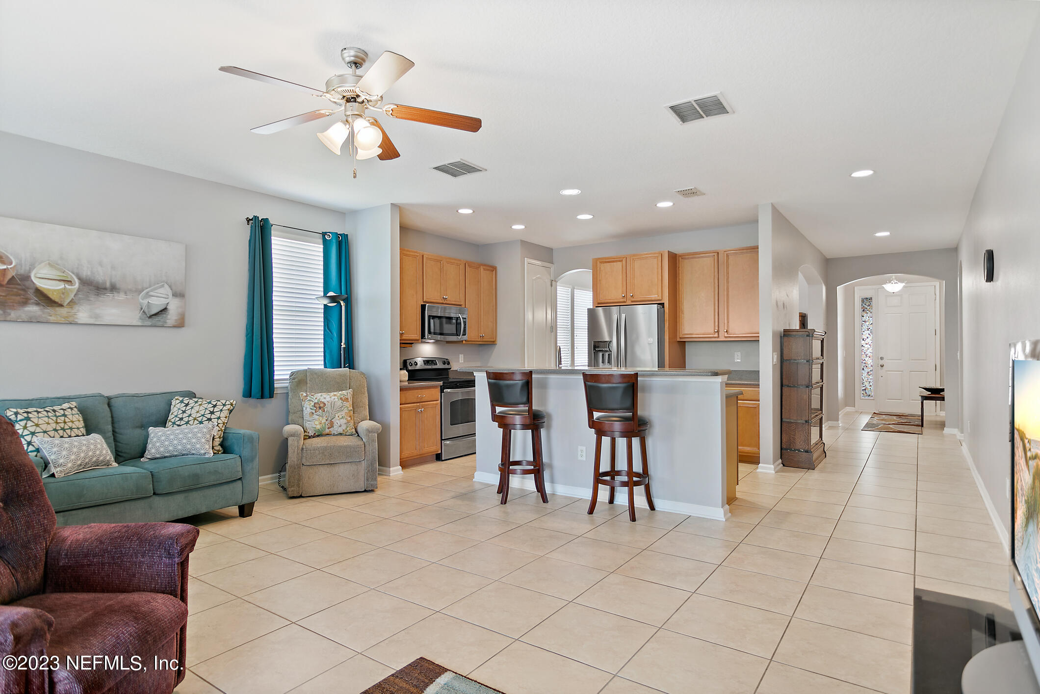 235 Pine Arbor Circle St. Augustine, FL 32084 - Photo 23 of 41 a living room with furniture and kitchen view