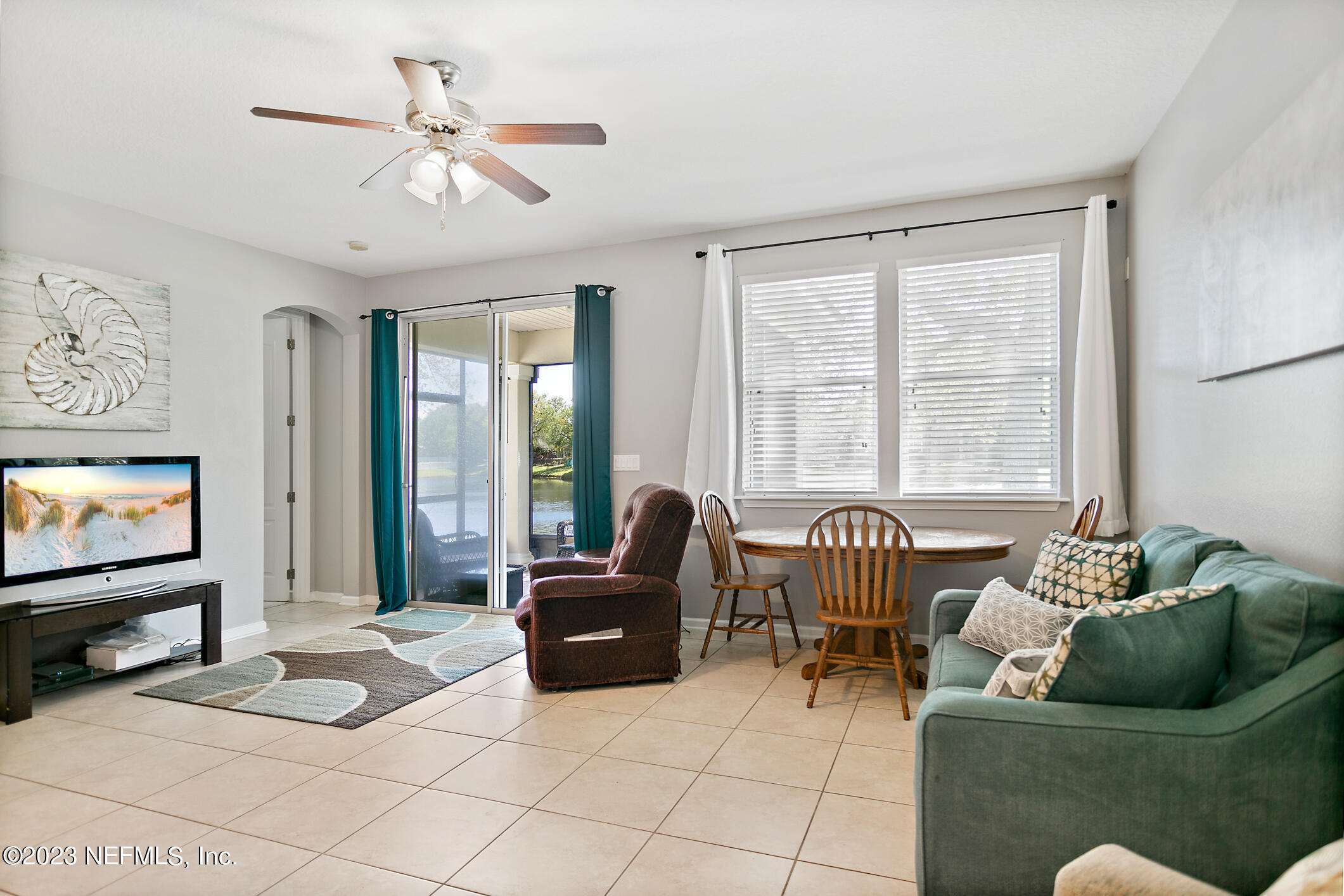 235 Pine Arbor Circle St. Augustine, FL 32084 - Photo 25 of 41 a living room with furniture and a flat screen tv