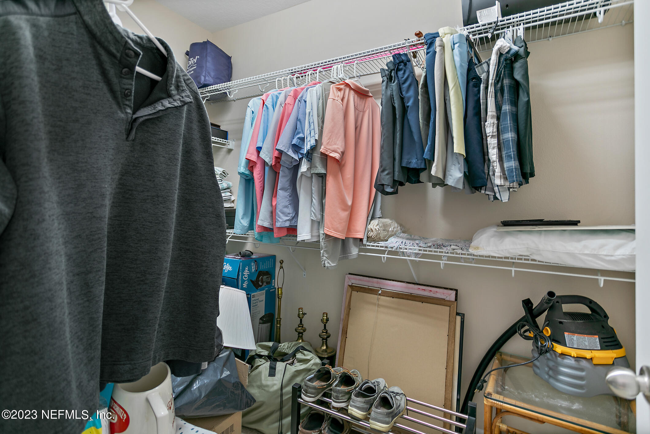 235 Pine Arbor Circle St. Augustine, FL 32084 - Photo 28 of 41 a view of walk in closet with clothes and shoes