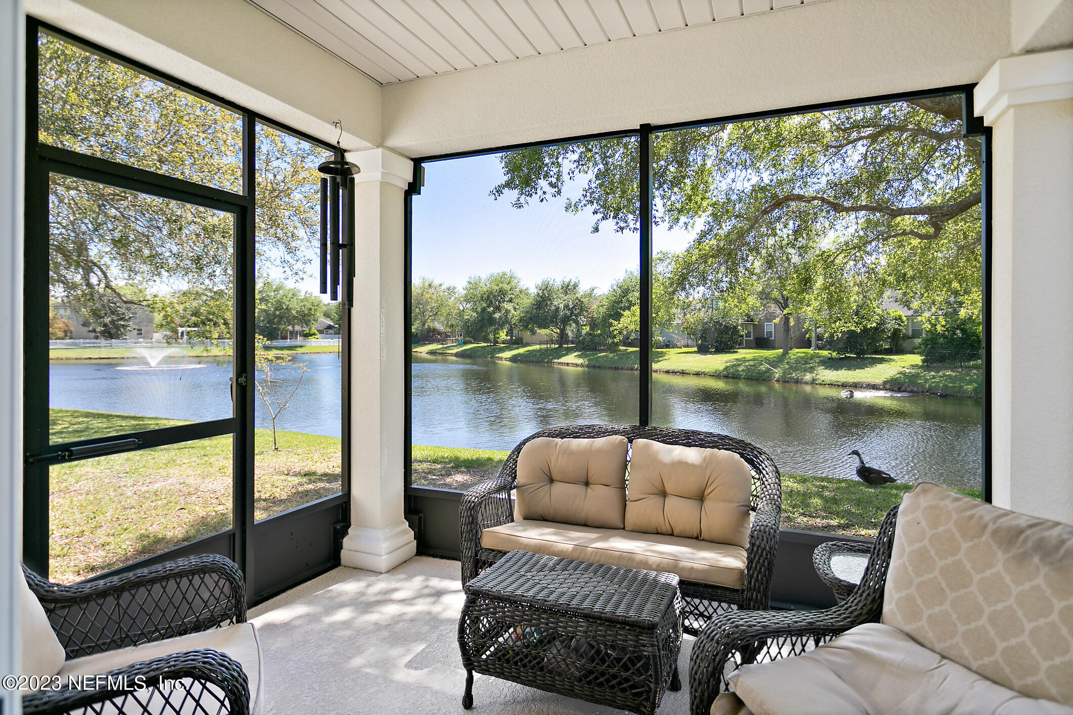 235 Pine Arbor Circle St. Augustine, FL 32084 - Photo 34 of 41 a living room with furniture and a floor to ceiling window