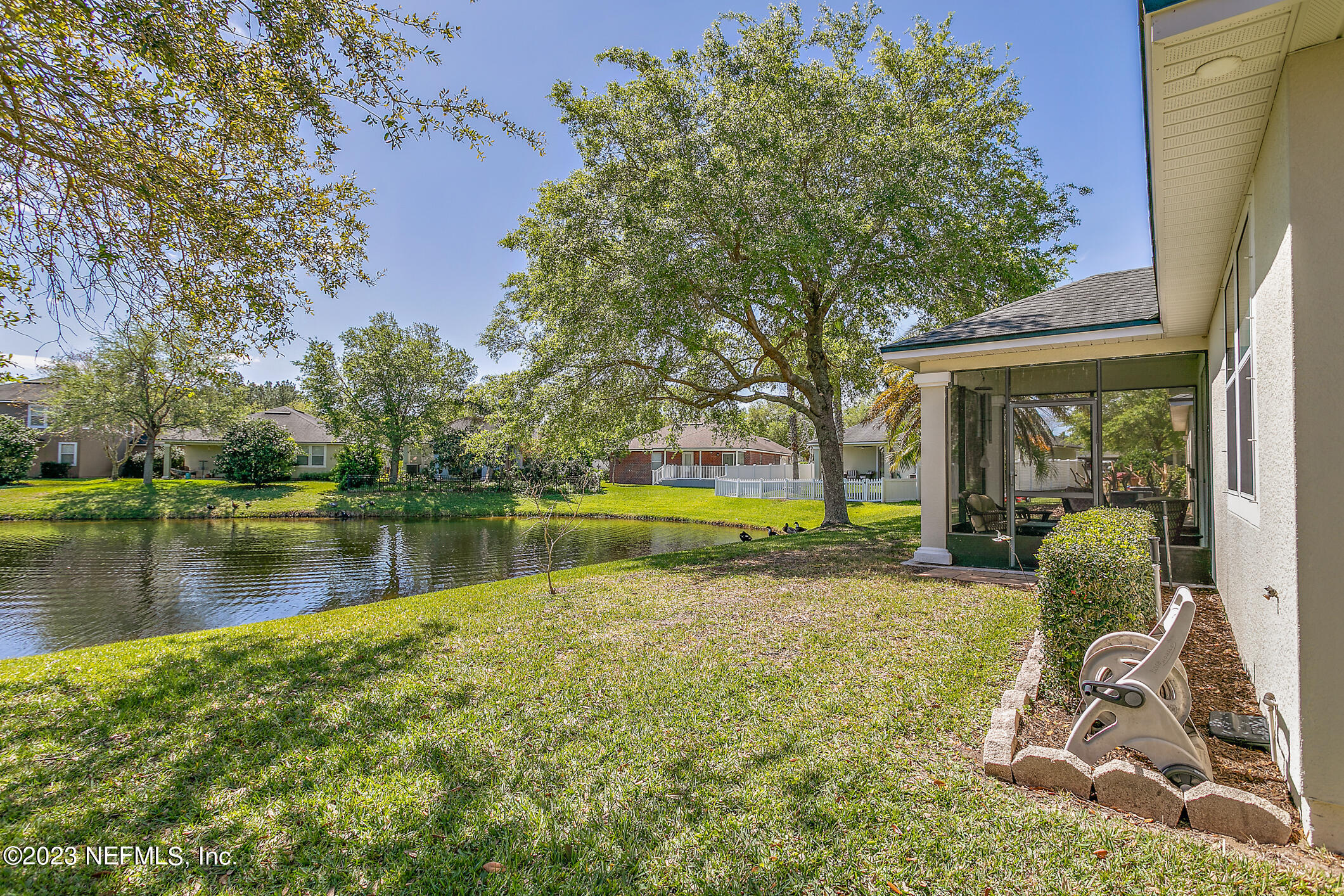 235 Pine Arbor Circle St. Augustine, FL 32084 - Photo 39 of 41 a view of a swimming pool with a patio and a yard
