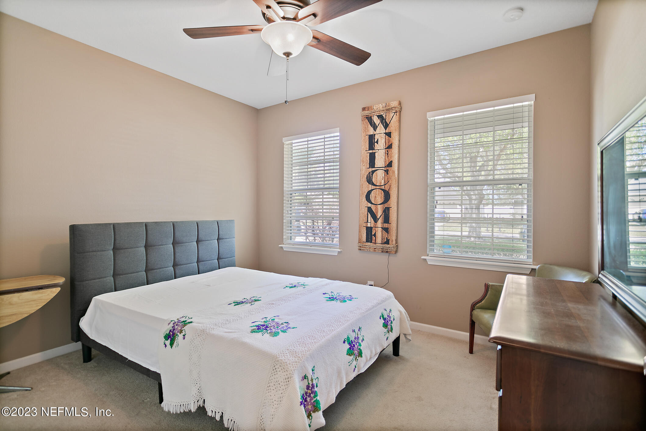 235 Pine Arbor Circle St. Augustine, FL 32084 - Photo 7 of 41 a bed sitting in a bedroom next to a window