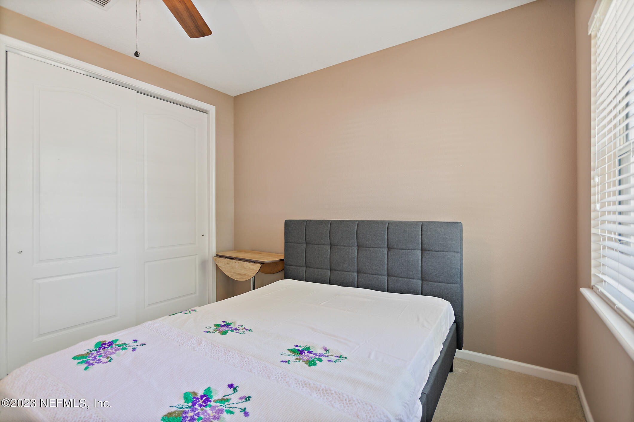 235 Pine Arbor Circle St. Augustine, FL 32084 - Photo 8 of 41 a bedroom with a bed and a window