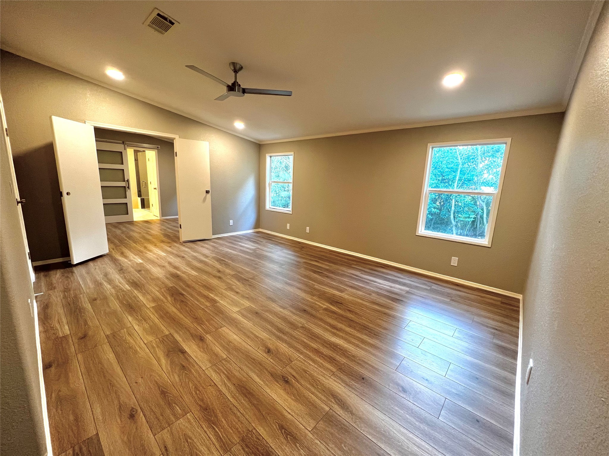 14505 Alice Road Tomball, TX 77377 - Photo 15 of 28 a view of an empty room with wooden floor and a window