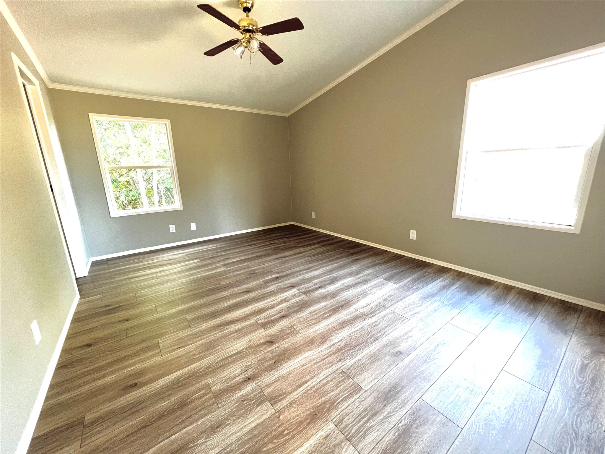 14505 Alice Road, Unit A Tomball, TX 77377 - Photo 21 of 28 a view of room with window and wooden floor