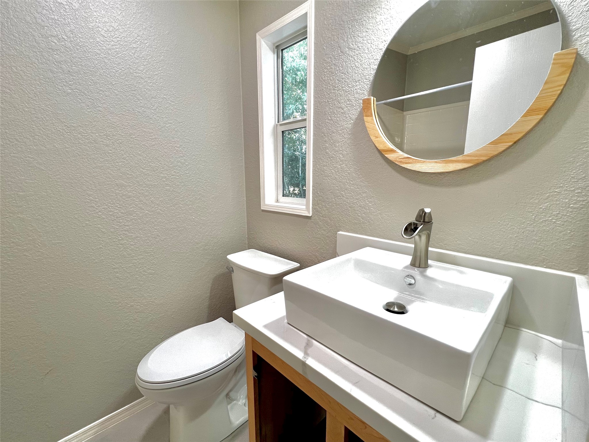14505 Alice Road, Unit A Tomball, TX 77377 - Photo 22 of 28 a bathroom with a sink and a mirror