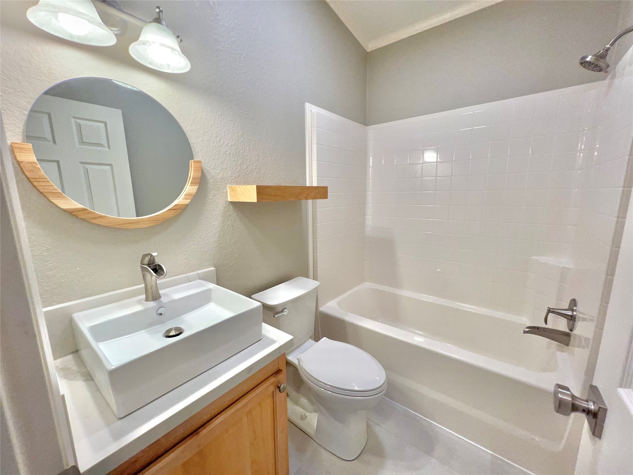 14505 Alice Road, Unit A Tomball, TX 77377 - Photo 24 of 28 a bathroom with a sink a toilet and bathtub