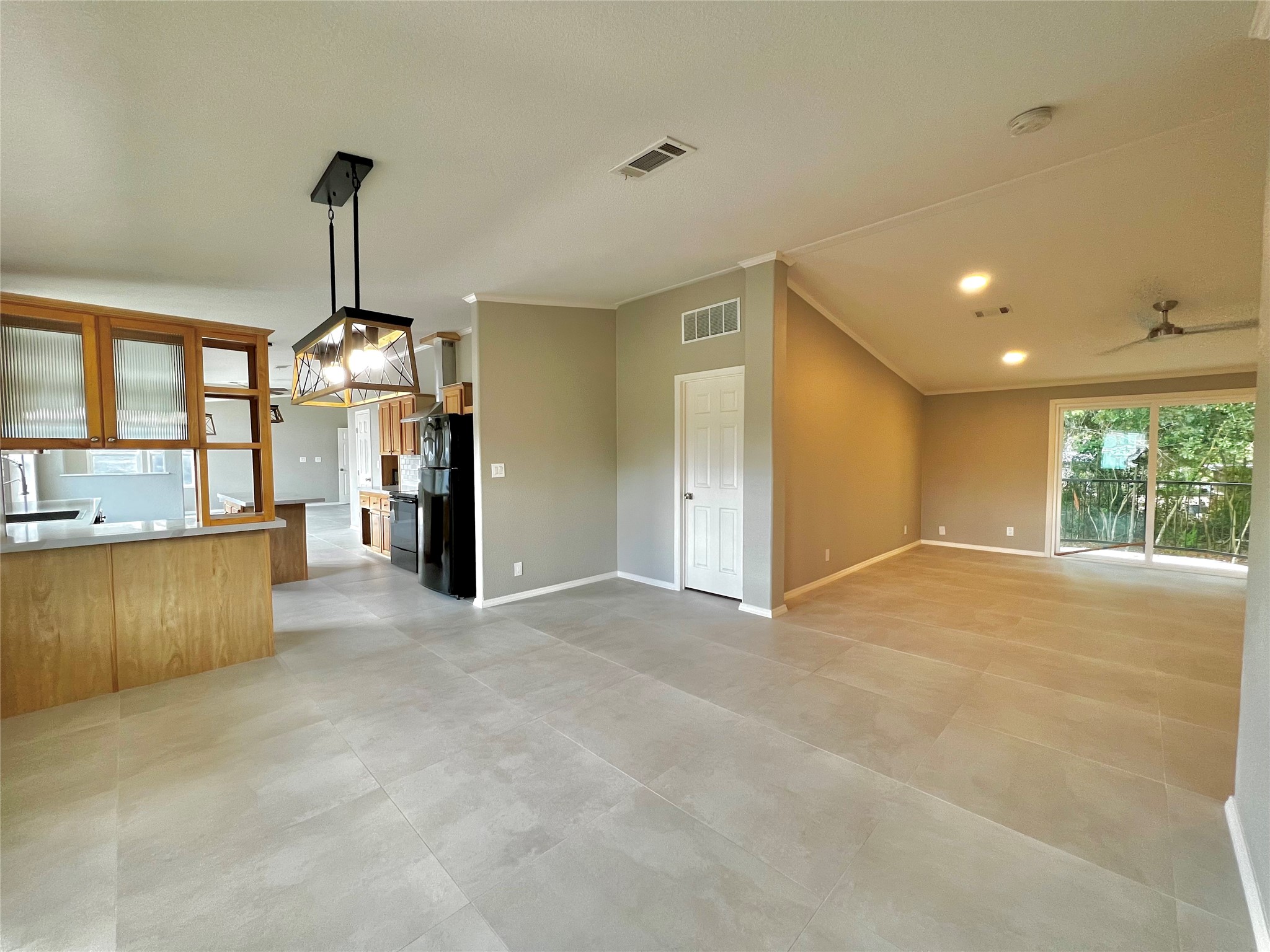 14505 Alice Road, Unit A Tomball, TX 77377 - Photo 3 of 28 a view of a kitchen with a refrigerator stove and a window