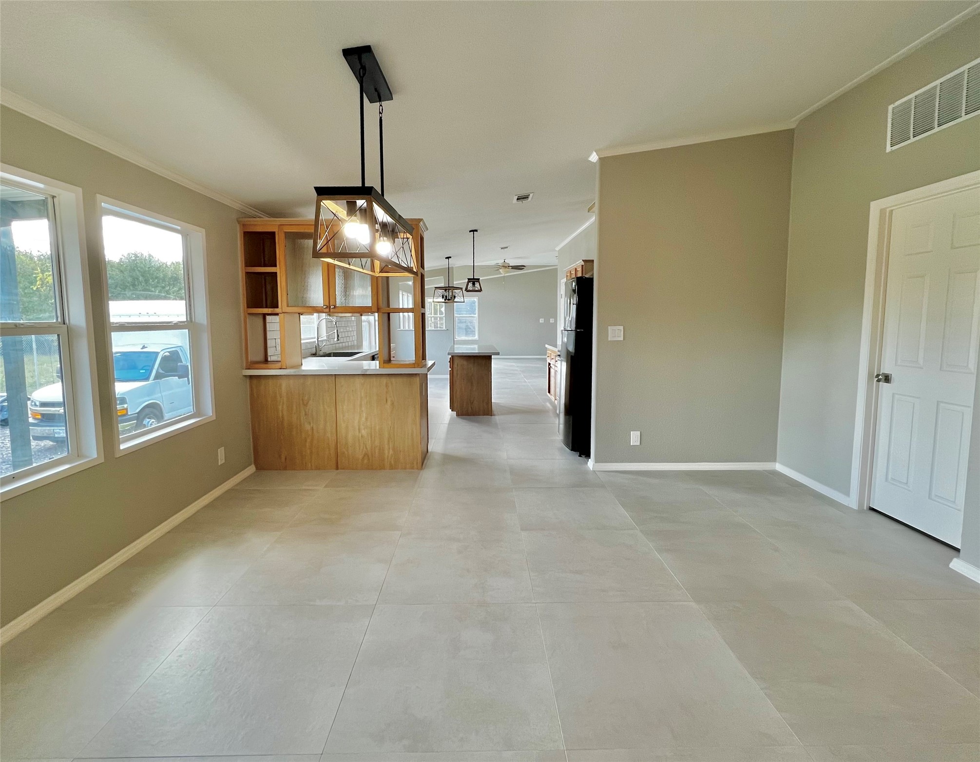 14505 Alice Road, Unit A Tomball, TX 77377 - Photo 4 of 28 a view of a room with a windows and wooden floor