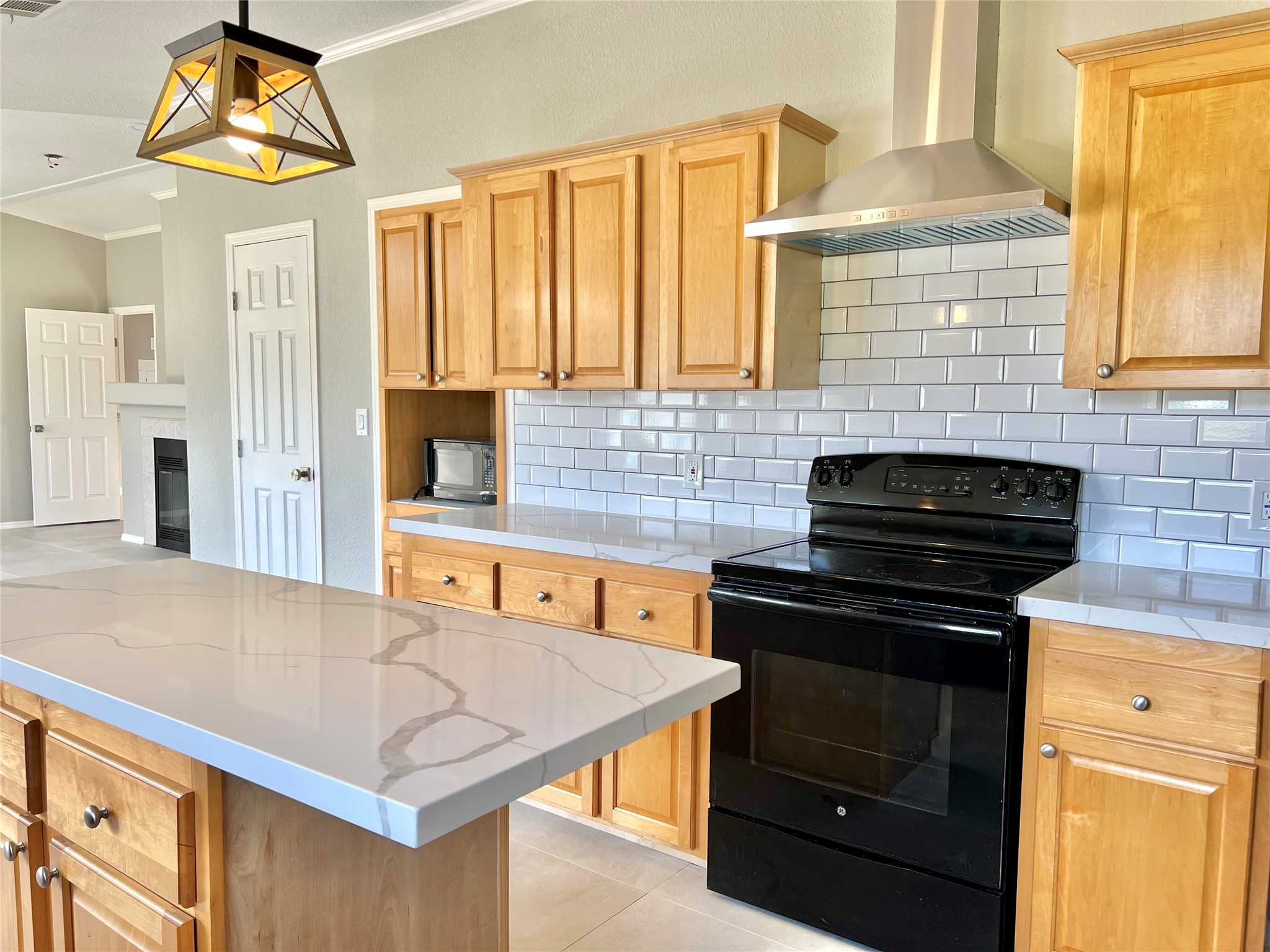 14505 Alice Road, Unit A Tomball, TX 77377 - Photo 6 of 28 a kitchen with stainless steel appliances granite countertop a stove a sink and a microwave