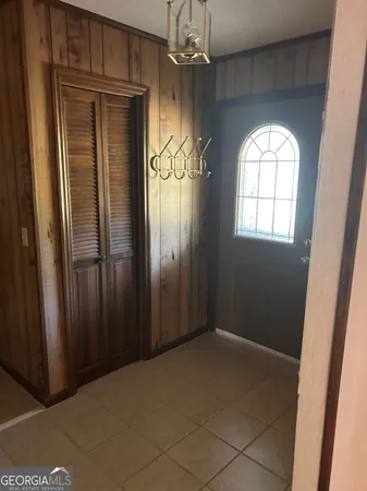 a view of a kitchen with wooden floor and a sink