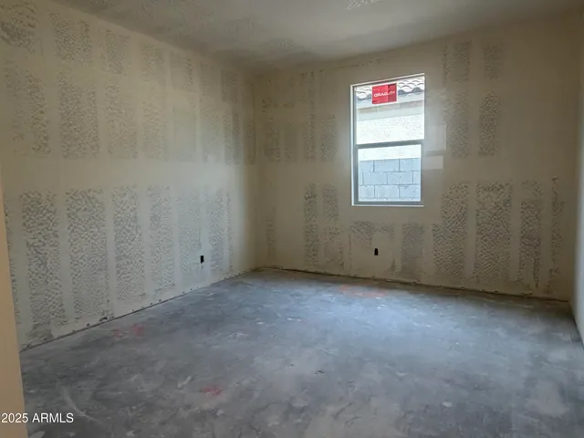 a view of an empty room and a window