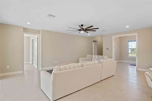a spacious bathroom with a granite countertop sink a mirror and shower