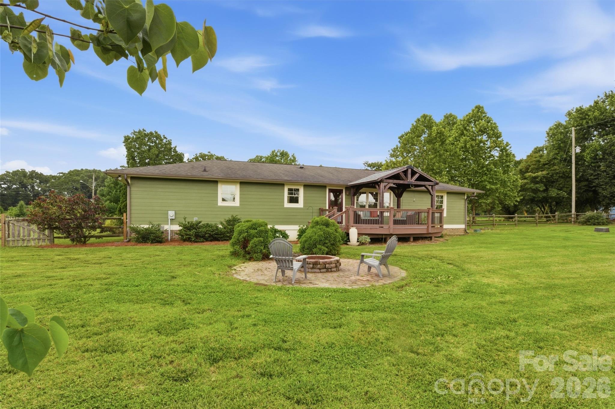 4712 Secrest Short Cut Road Monroe, NC 28110 - Photo 22 of 30 a front view of a house with a garden