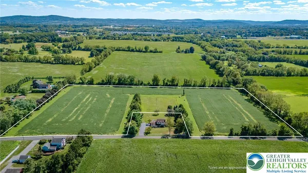 an aerial view of a golf course with a garden