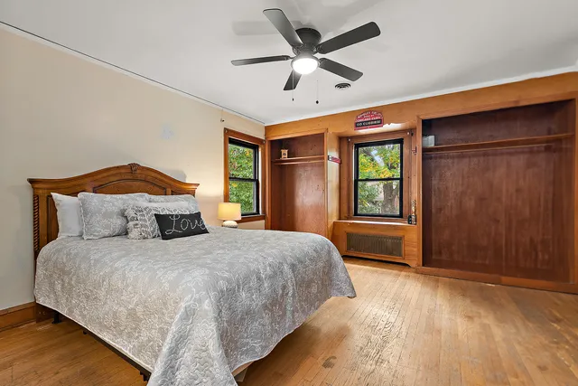 a bedroom with a large bed and a large window