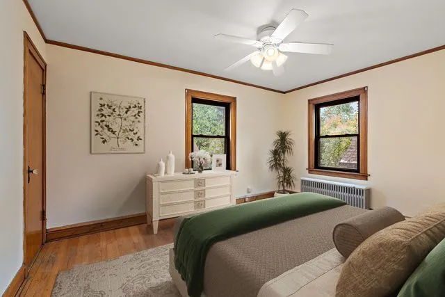 a bedroom with a large bed and a window