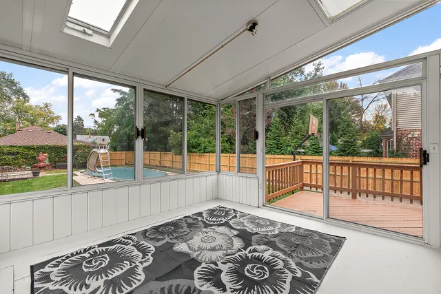 a view of a balcony with wooden floor