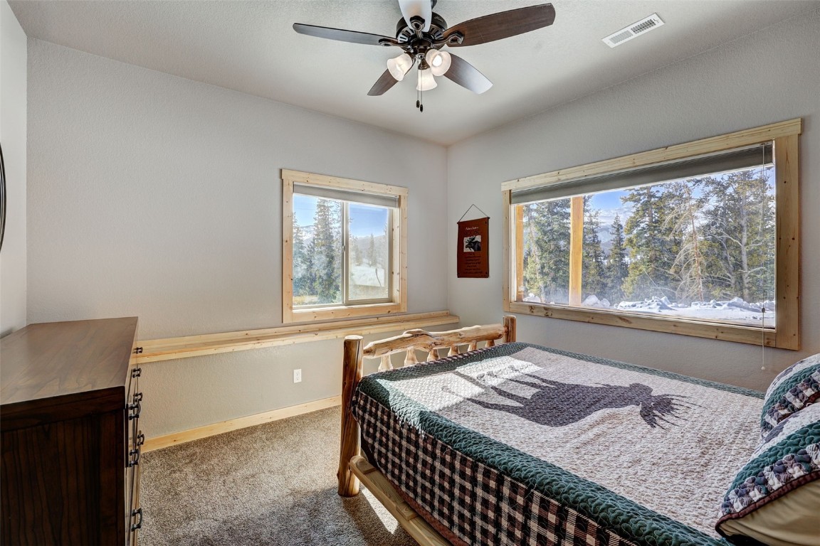 207 Pine Cone Way Fairplay, CO 80440 - Photo 21 of 45 a bedroom with a bed and a window