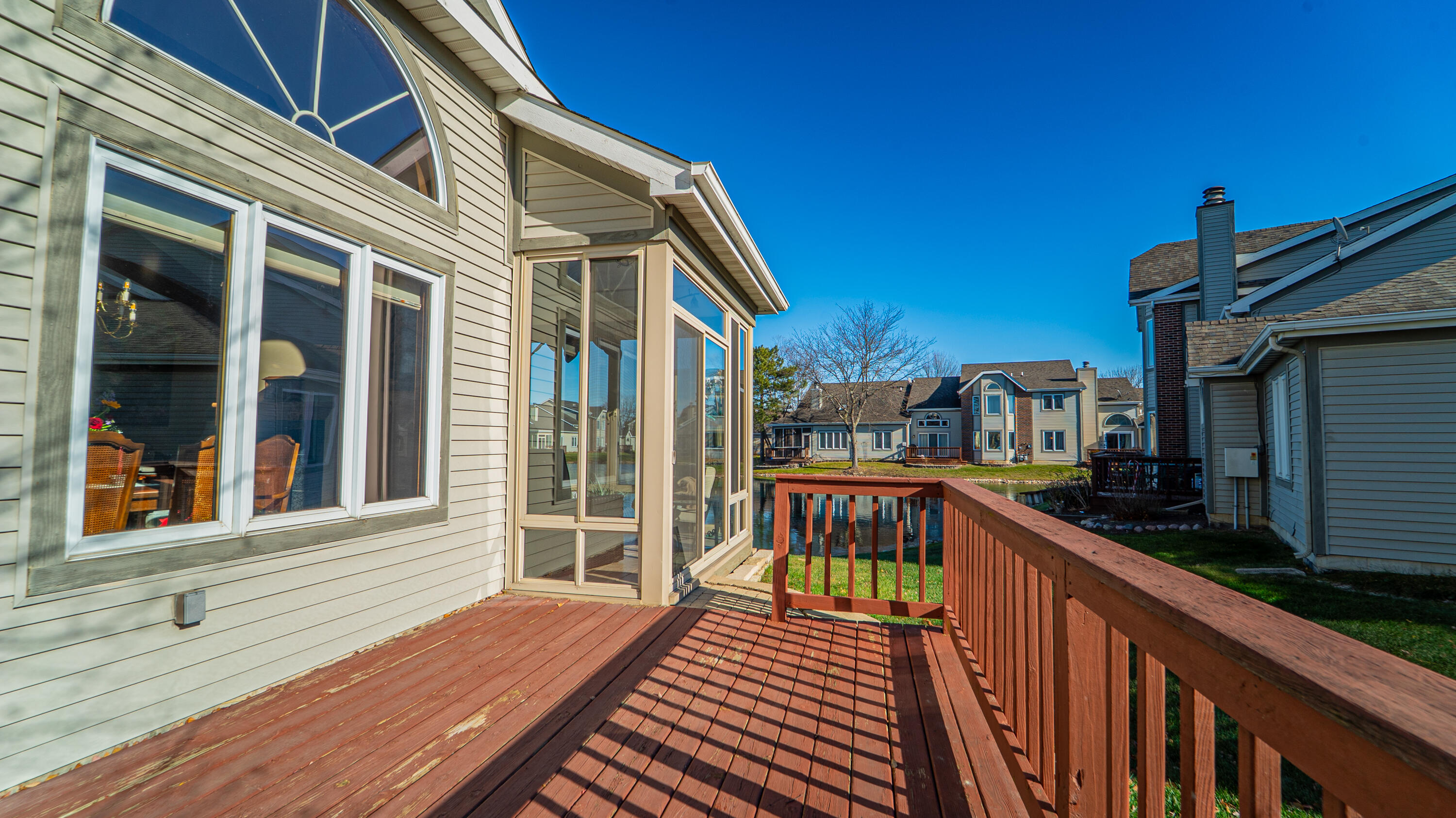 9427 Van Buren Street Crown Point, IN 46307 - Photo 12 of 46 a balcony with wooden floor and outdoor seating