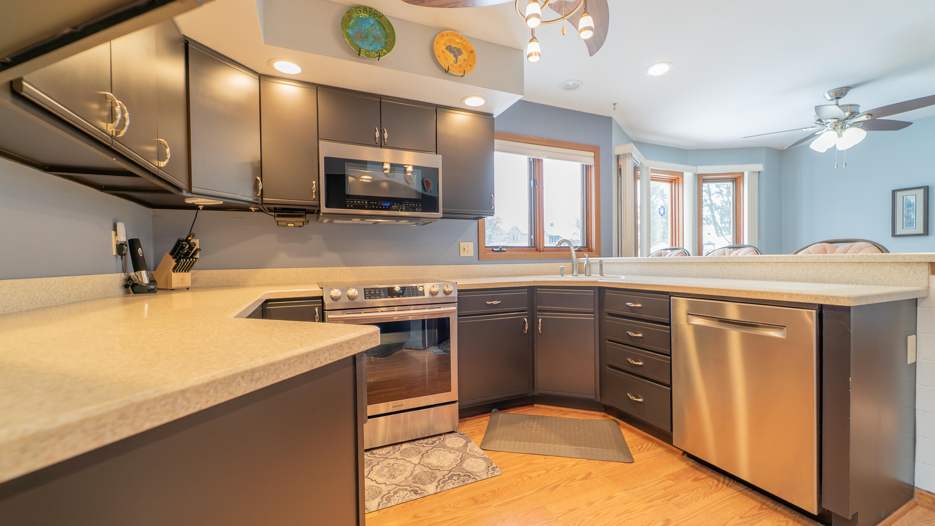 9427 Van Buren Street Crown Point, IN 46307 - Photo 15 of 46 a kitchen with a sink appliances and cabinets