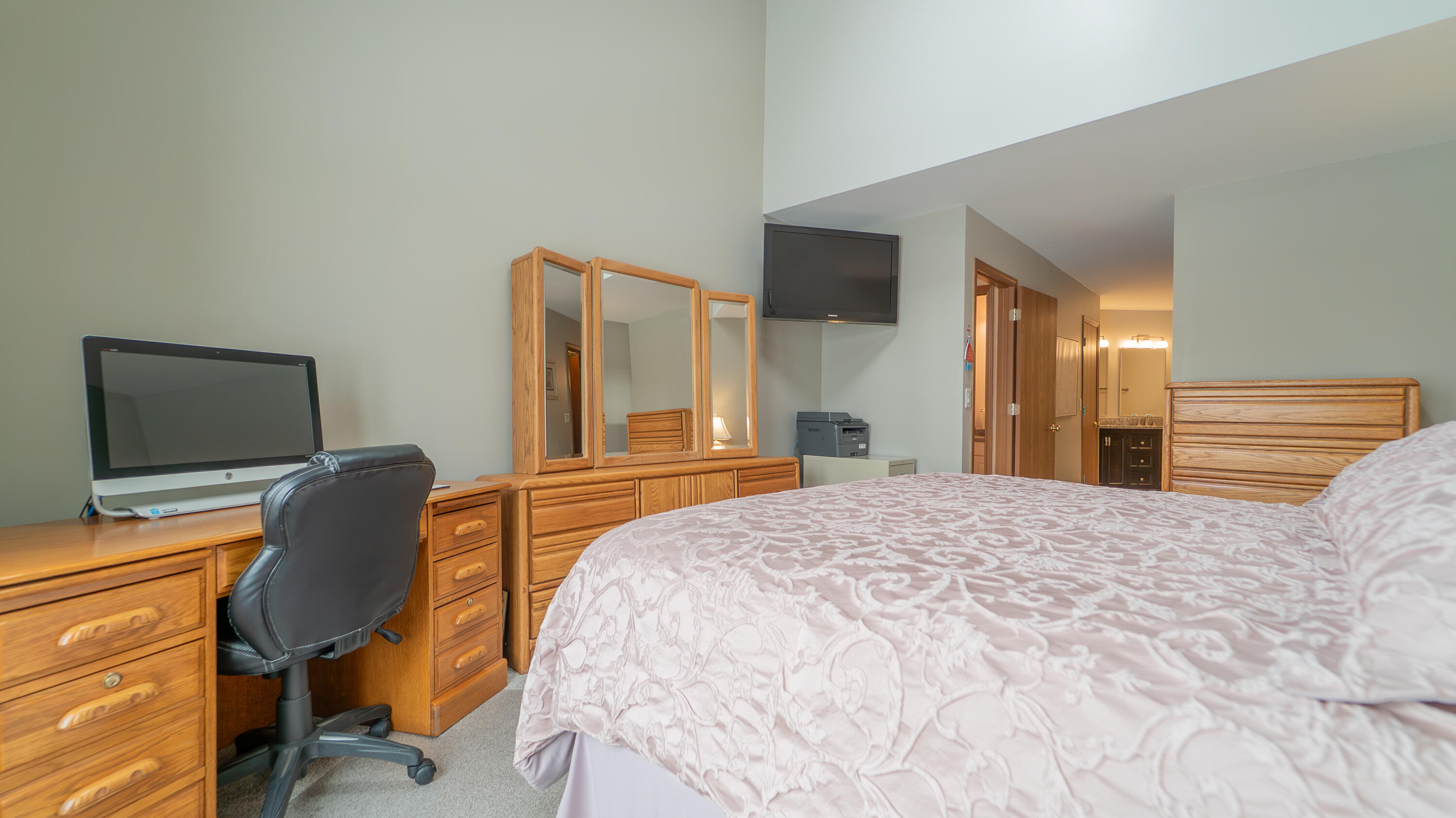 9427 Van Buren Street Crown Point, IN 46307 - Photo 23 of 46 a bedroom with a bed and chair