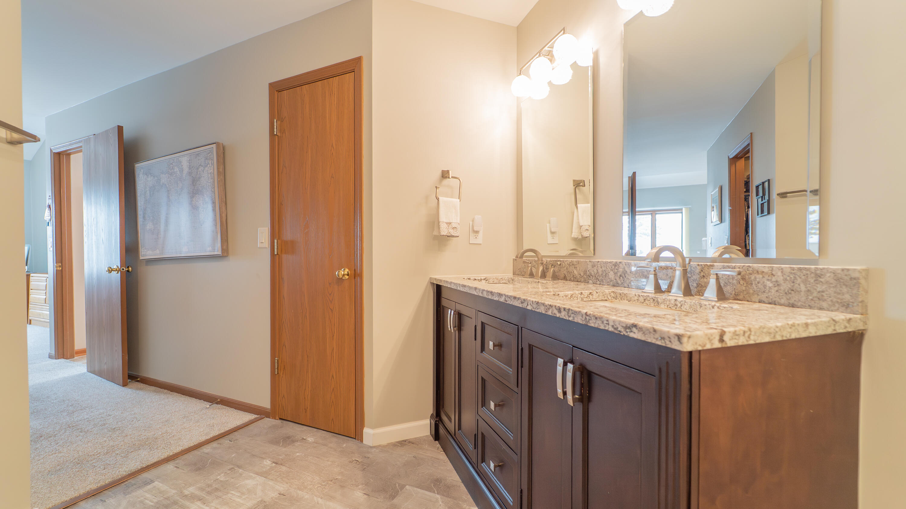 9427 Van Buren Street Crown Point, IN 46307 - Photo 26 of 46 a bathroom with a granite countertop sink and a mirror