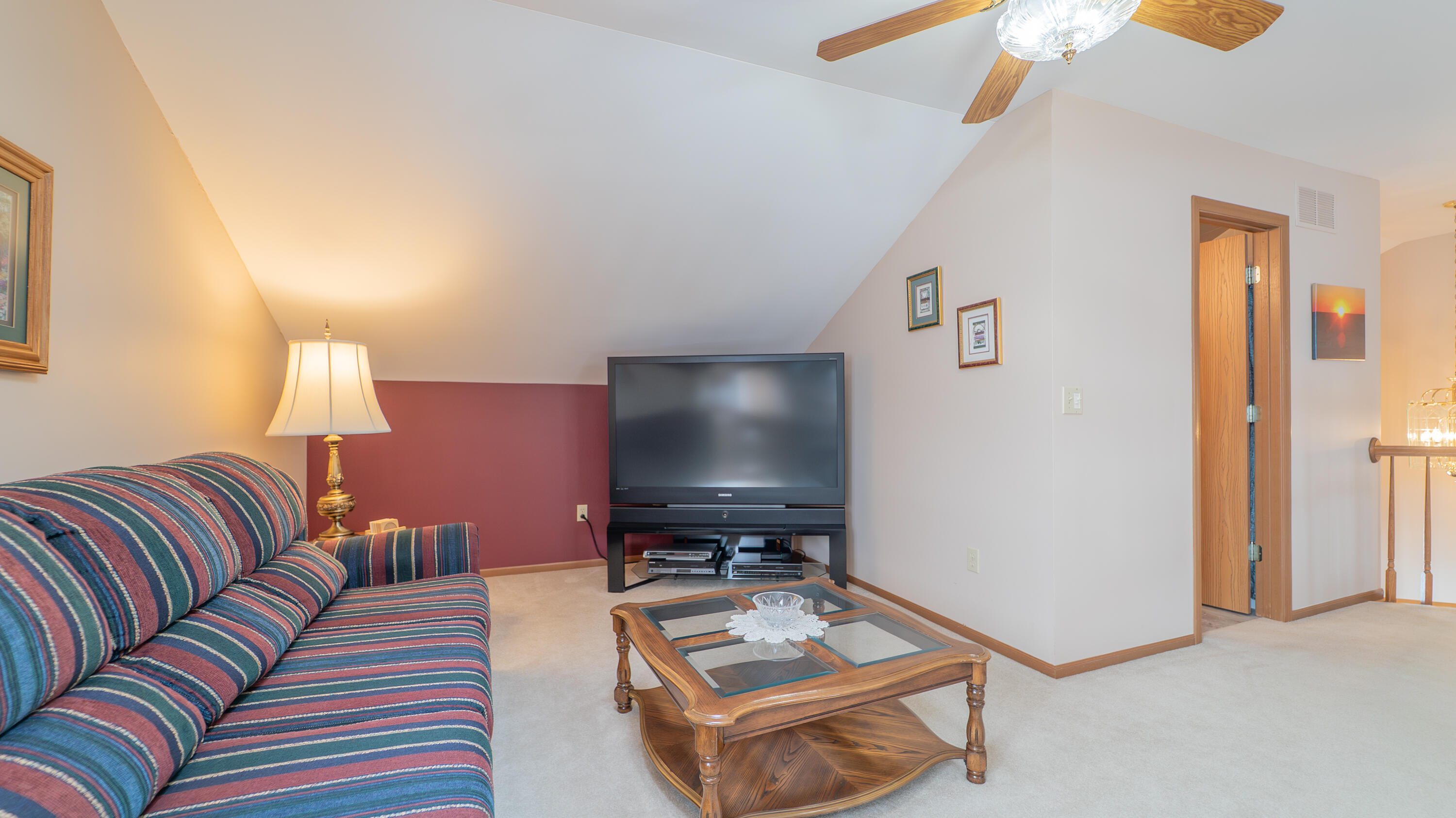 9427 Van Buren Street Crown Point, IN 46307 - Photo 29 of 46 a living room with furniture and a flat screen tv