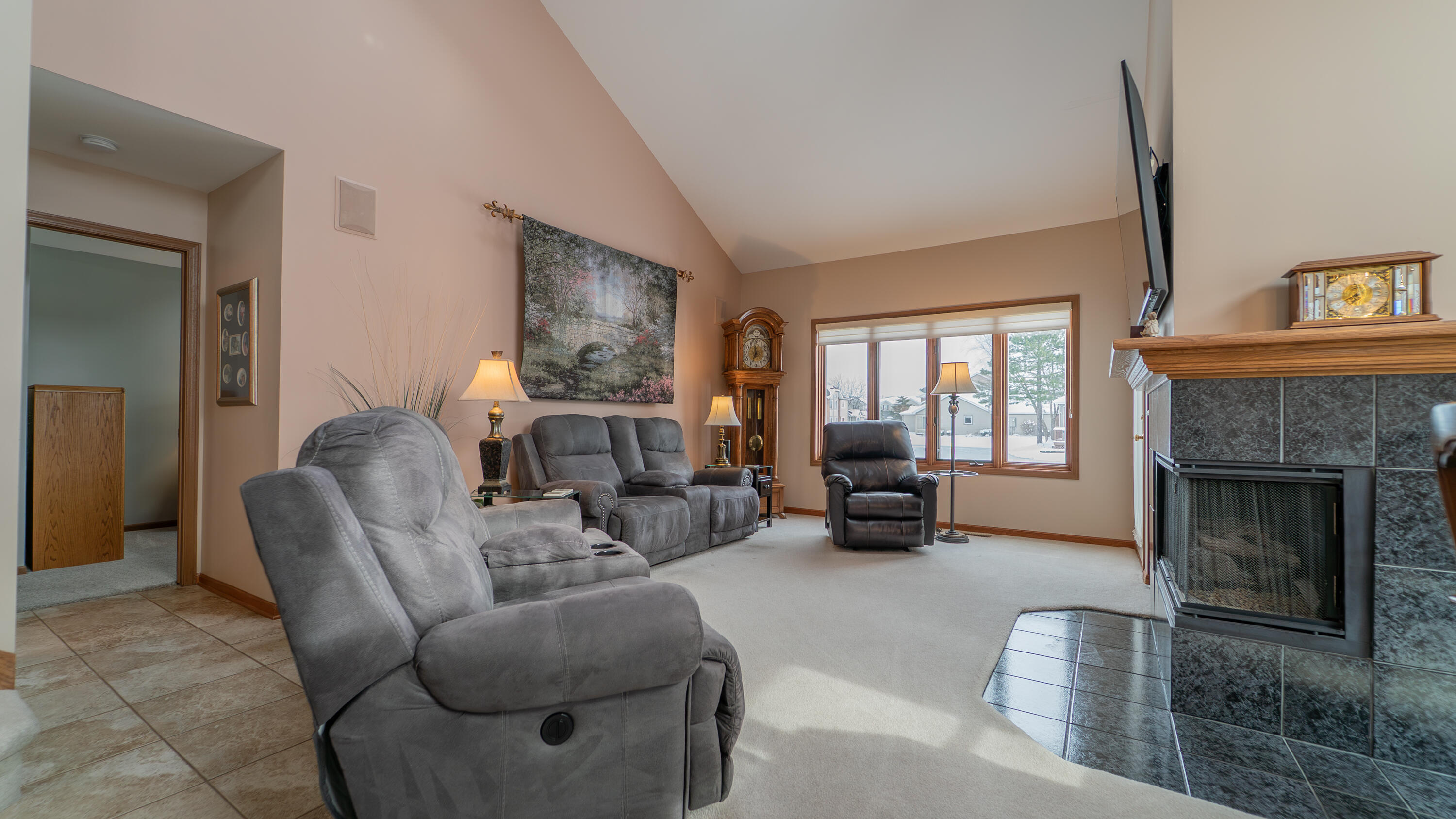9427 Van Buren Street Crown Point, IN 46307 - Photo 7 of 46 a living room with furniture and a fireplace