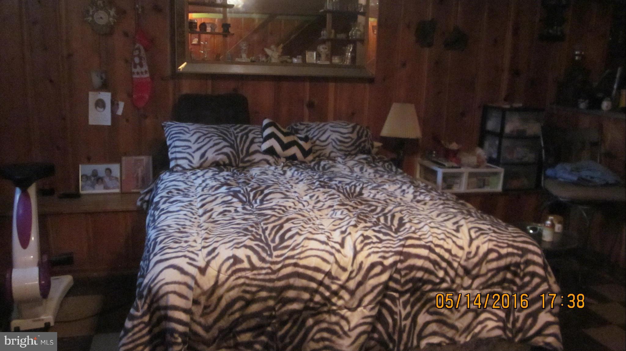 1334 Stonewood Road Baltimore, MD 21239 - Photo 12 of 18 a bed with a bed