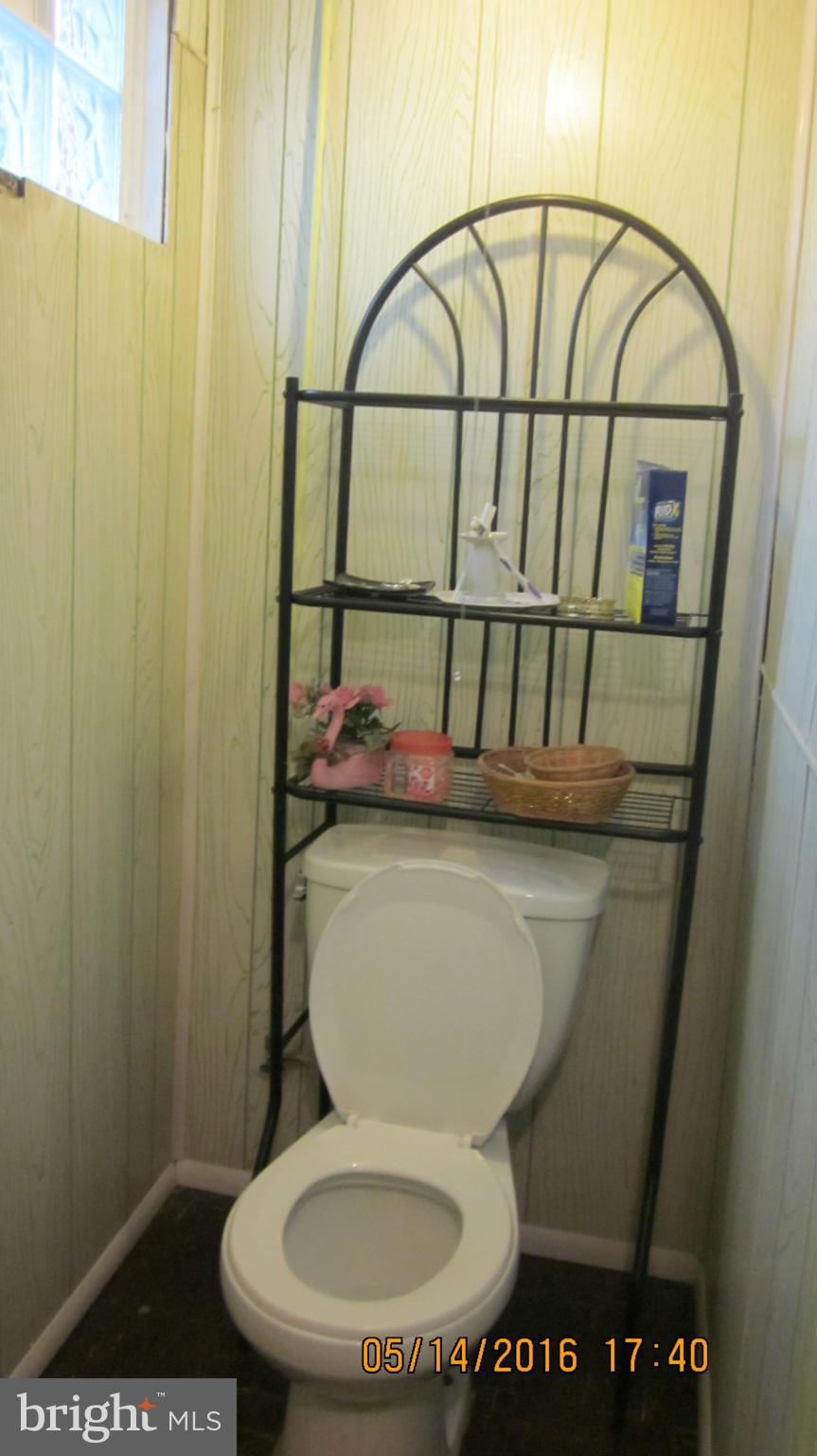 1334 Stonewood Road Baltimore, MD 21239 - Photo 17 of 18 a bathroom with a toilet and a sink