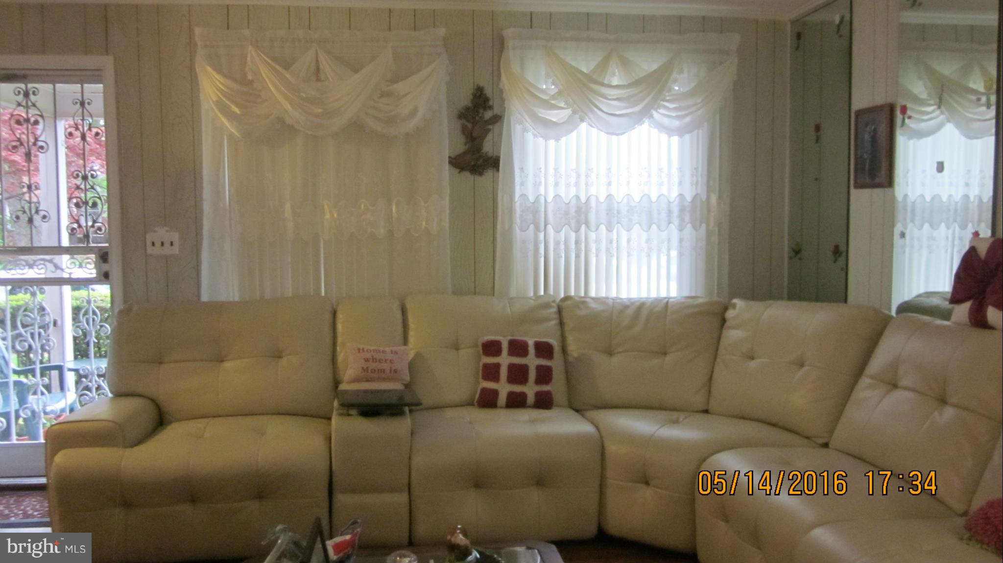 1334 Stonewood Road Baltimore, MD 21239 - Photo 5 of 18 a living room with furniture and a window