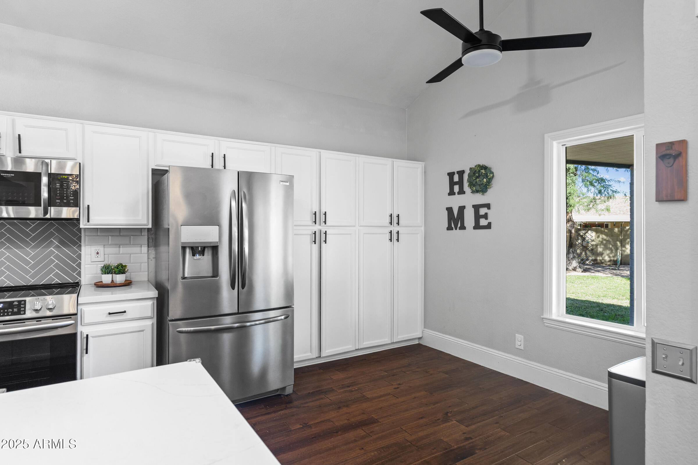 1645 North Saguaro Street Chandler, AZ 85224 - Photo 19 of 45 a kitchen with stainless steel appliances a refrigerator and a stove top oven