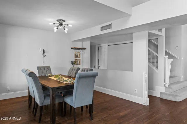 a view of a livingroom with furniture window and wooden floor