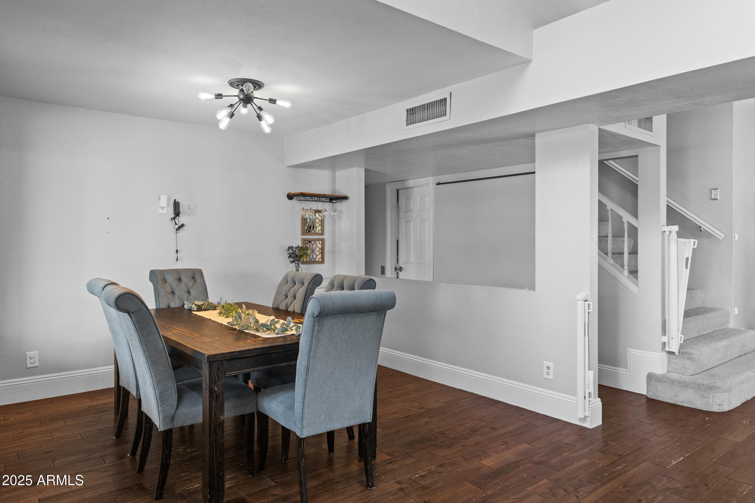 1645 North Saguaro Street Chandler, AZ 85224 - Photo 26 of 45 a view of a dining room with furniture and wooden floor