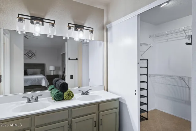 a bedroom with a bed and a dresser