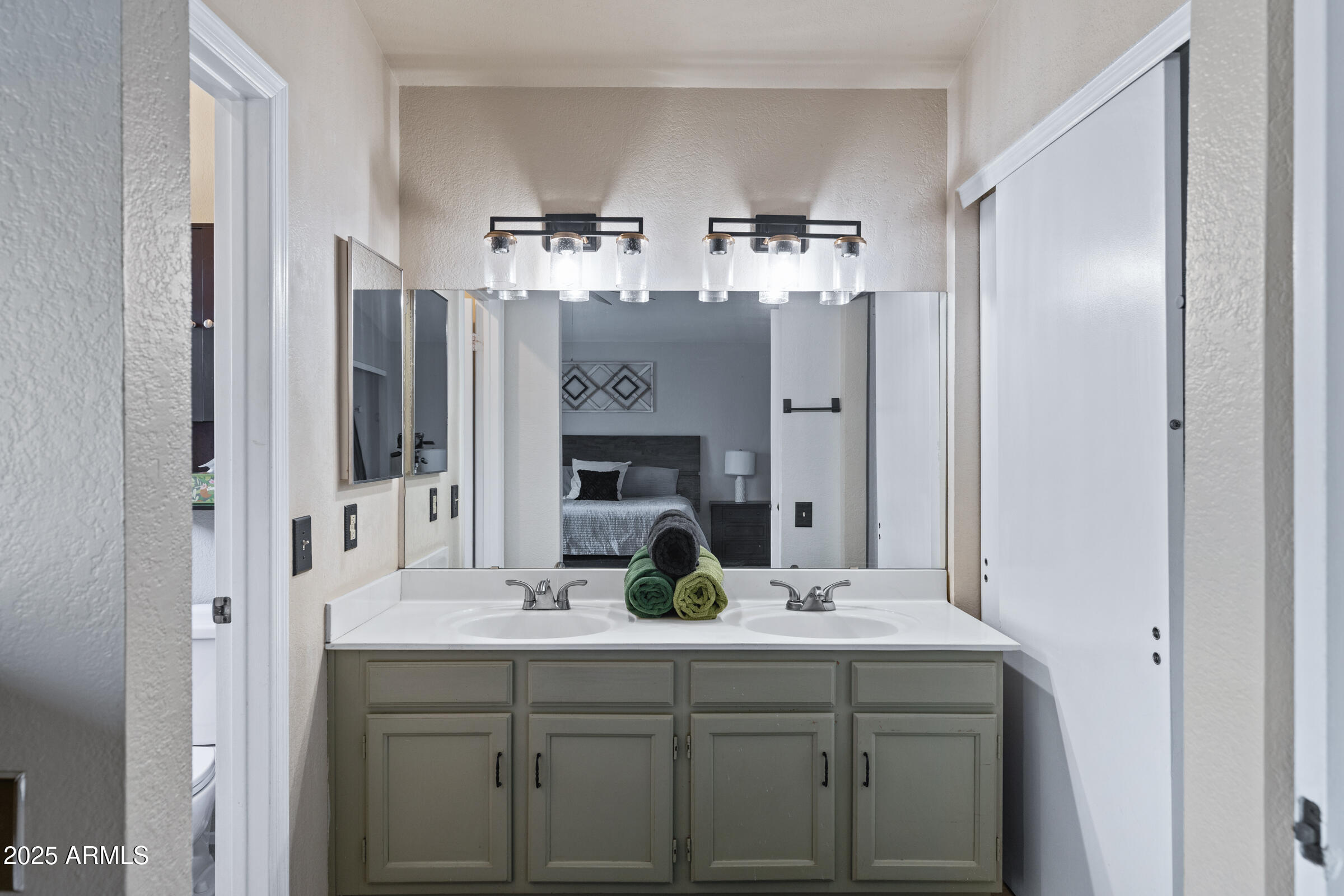 1645 North Saguaro Street Chandler, AZ 85224 - Photo 33 of 45 a bathroom with double vanity sink and a mirror