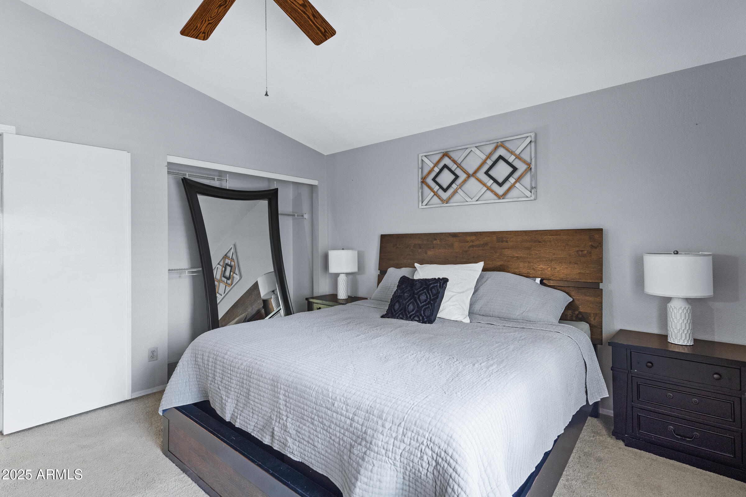 1645 North Saguaro Street Chandler, AZ 85224 - Photo 35 of 45 a bedroom with a bed and a mirror