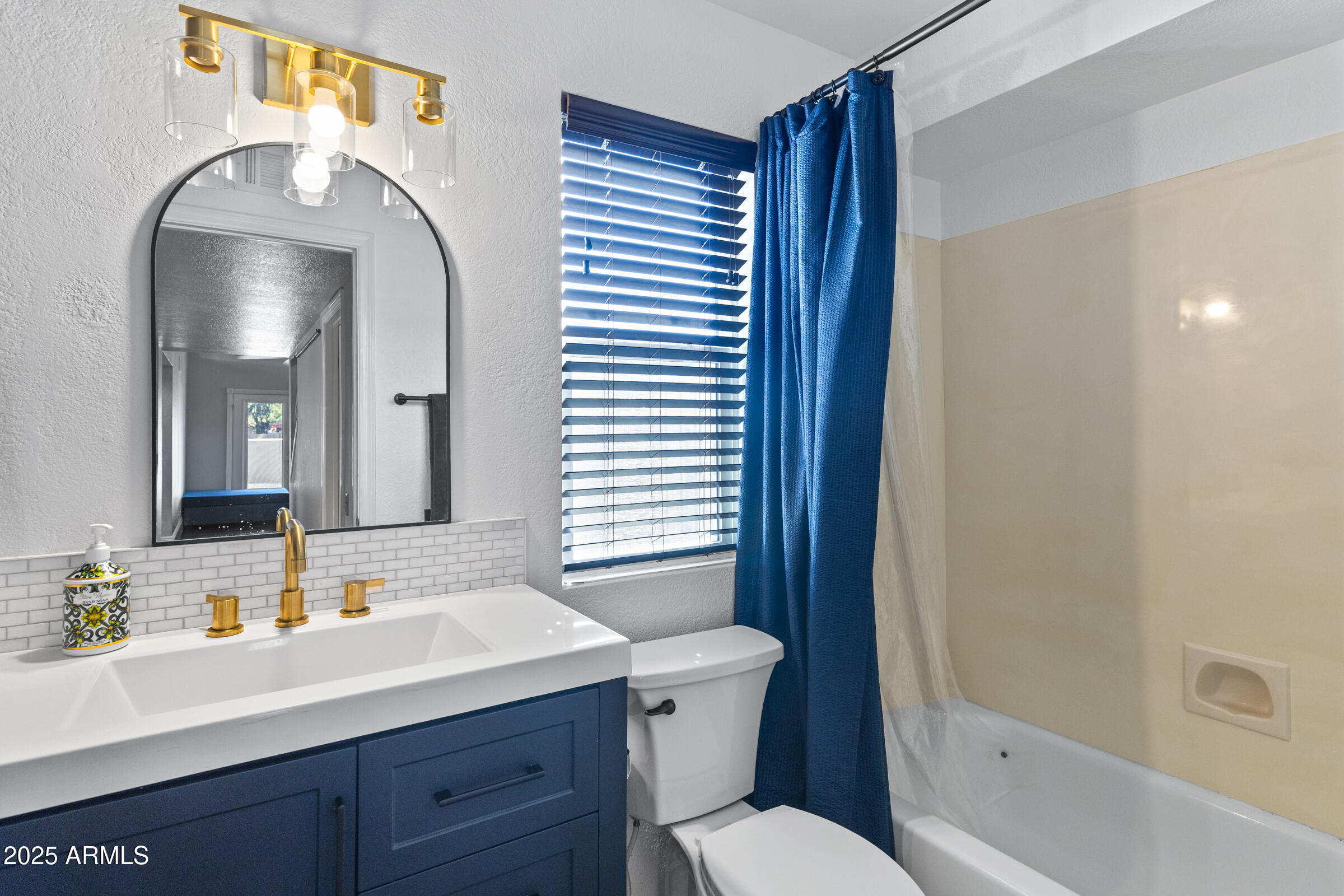 1645 North Saguaro Street Chandler, AZ 85224 - Photo 42 of 45 a bathroom with a sink a toilet and shower