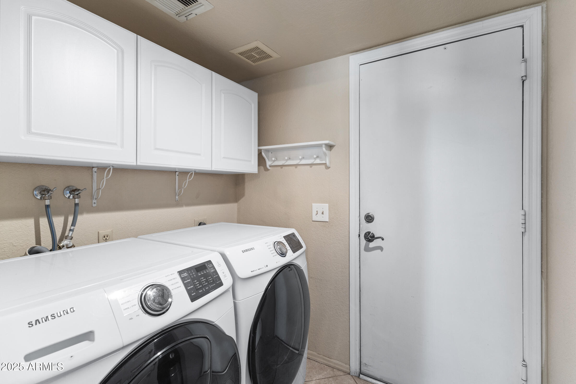1645 North Saguaro Street Chandler, AZ 85224 - Photo 45 of 45 a utility room with dryer and washer