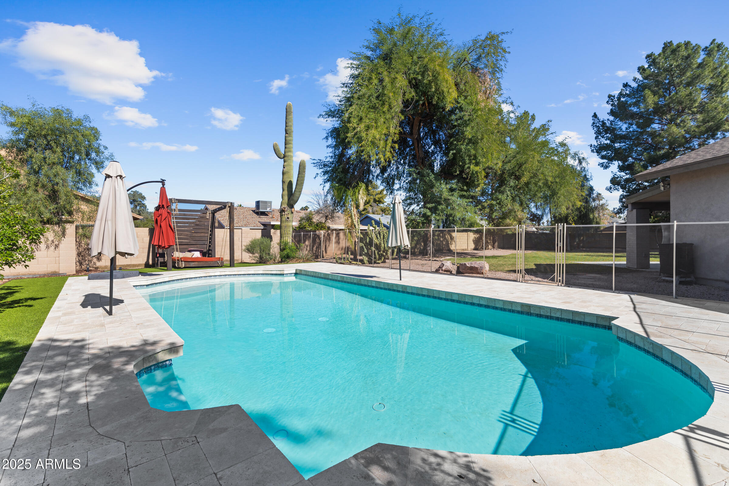 1645 North Saguaro Street Chandler, AZ 85224 - Photo 7 of 45 a view of a swimming pool with a patio