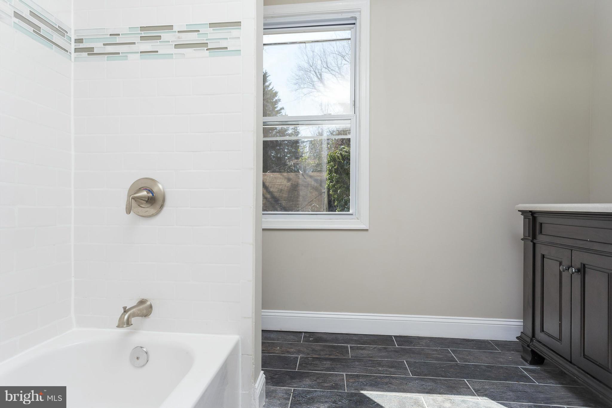 2304 Monticello Road Baltimore, MD 21216 - Photo 20 of 30 a bathroom with a bathtub and shower
