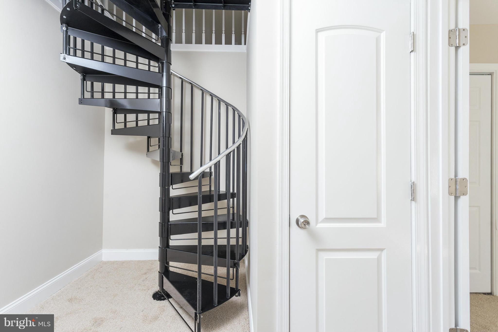 2304 Monticello Road Baltimore, MD 21216 - Photo 24 of 30 a view of staircase with white walls and a window
