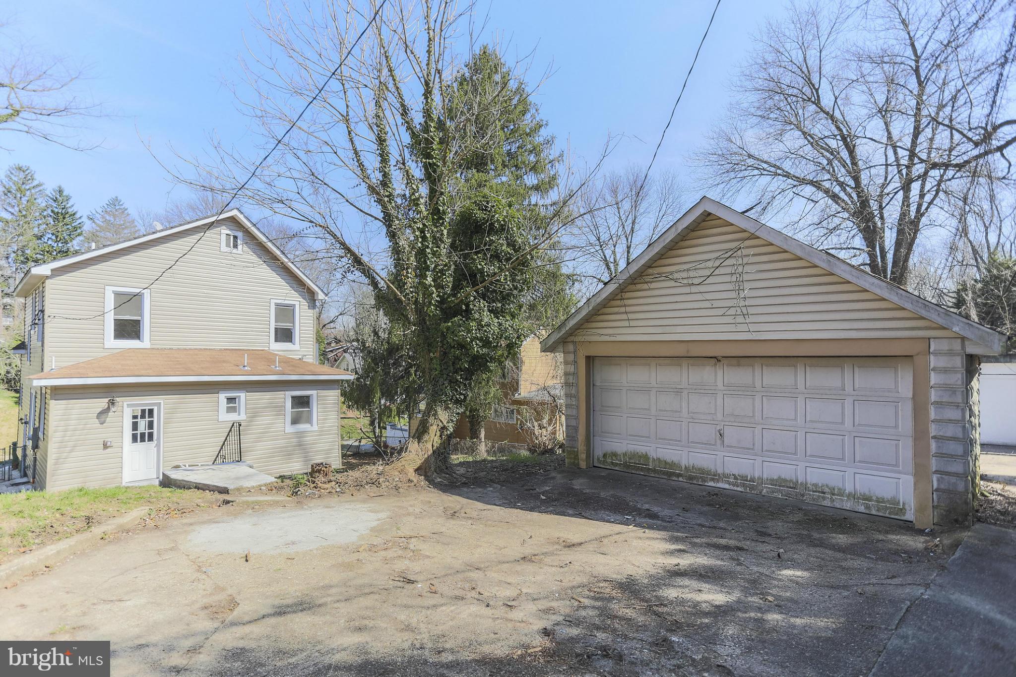 2304 Monticello Road Baltimore, MD 21216 - Photo 29 of 30 a view of a house with a yard and garage